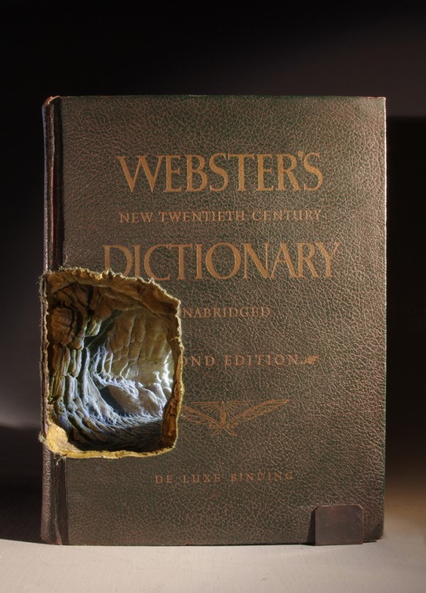 Guy Laramee, The Way Out, carved book, pigmented ink, and lamp.