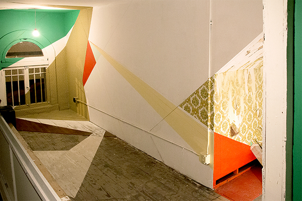 Lisa Wicka. Construction of Self (detail), 2013; House paint, vintage wallpaper, laminate flooring, wood and chalk line; two interior spaces: 5 x 7 x 15 feet and 4 x 5 x 6 feet. Courtesy of the artist.