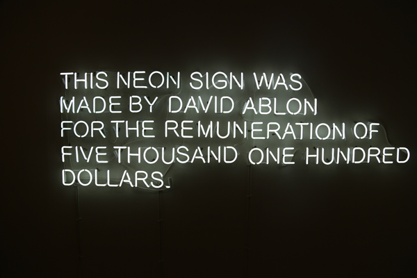 Claire Fontaine. This Neon Sign Was Made By..., 2009; Back-painted neon, 6400k glass, cables, fixtures and transformers; 19 11/16 x 118 1/8 in. Courtesy of the artist and Metro Pictures, New York. Photo: Erin Fletcher