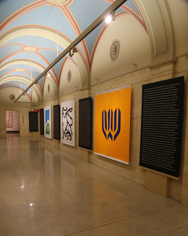 Superflex. Bankrupt Banks, 2008 – present; Banners: paint on fabric, 79 x 79 in. Panels: vinyl on painted MDF, 79 x 39.5 in. Coppel Collection, image courtesy of Nils Staerk and Fundación Jumex Arte Contemporáneo.