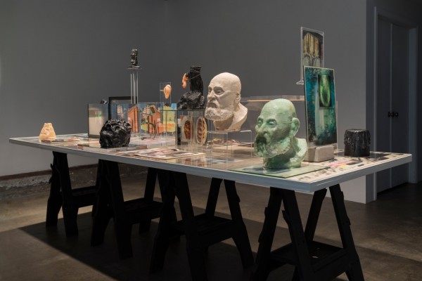 Matt Borruso. Forming, 2012–14; installation view, Wax House of Wax, 2014; plastic, Plexiglas, glass, mirrors, cut paper, ceramic, unfired clay, silicone, wax, talc, lenticular photographs, holograms, wood, tape, rubber bands, linen, concrete, steel, elastic, books, magazines, airbrush paint, inkjet prints, transparencies, posters, wallpaper; 120 x 42 x 61 in. Courtesy of the Artist and Steven Wolf Fine Arts, San Francisco.