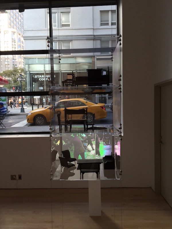 Zoe Beloff. Glass House, 2015; Plexiglas, three video projections, miniature furniture, metal fasteners; 24  x 24  x 48 in. Photo: Alex Bigman.