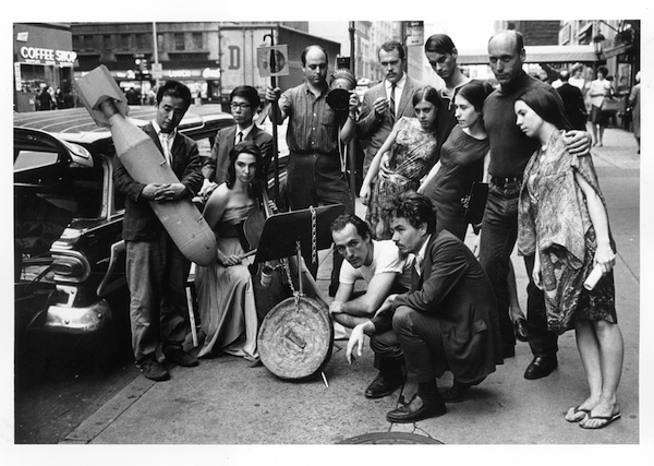 Peter Moore. Publicity photograph for 3rd Annual New York Avant-Garde Festival, August 26, 1965; left to right: Nam June Paik, Charlotte Moorman, Takehisa Kosugi, Gary Harris, Dick Higgins, Judith Kuemmerle, Kenneth King, Meredith Monk, Al Kurchin, Phoebe Neville; in front, kneeling: Philip Corner and James Tenney. Photo © Barbara Moore/Licensed by VAGA, NY.